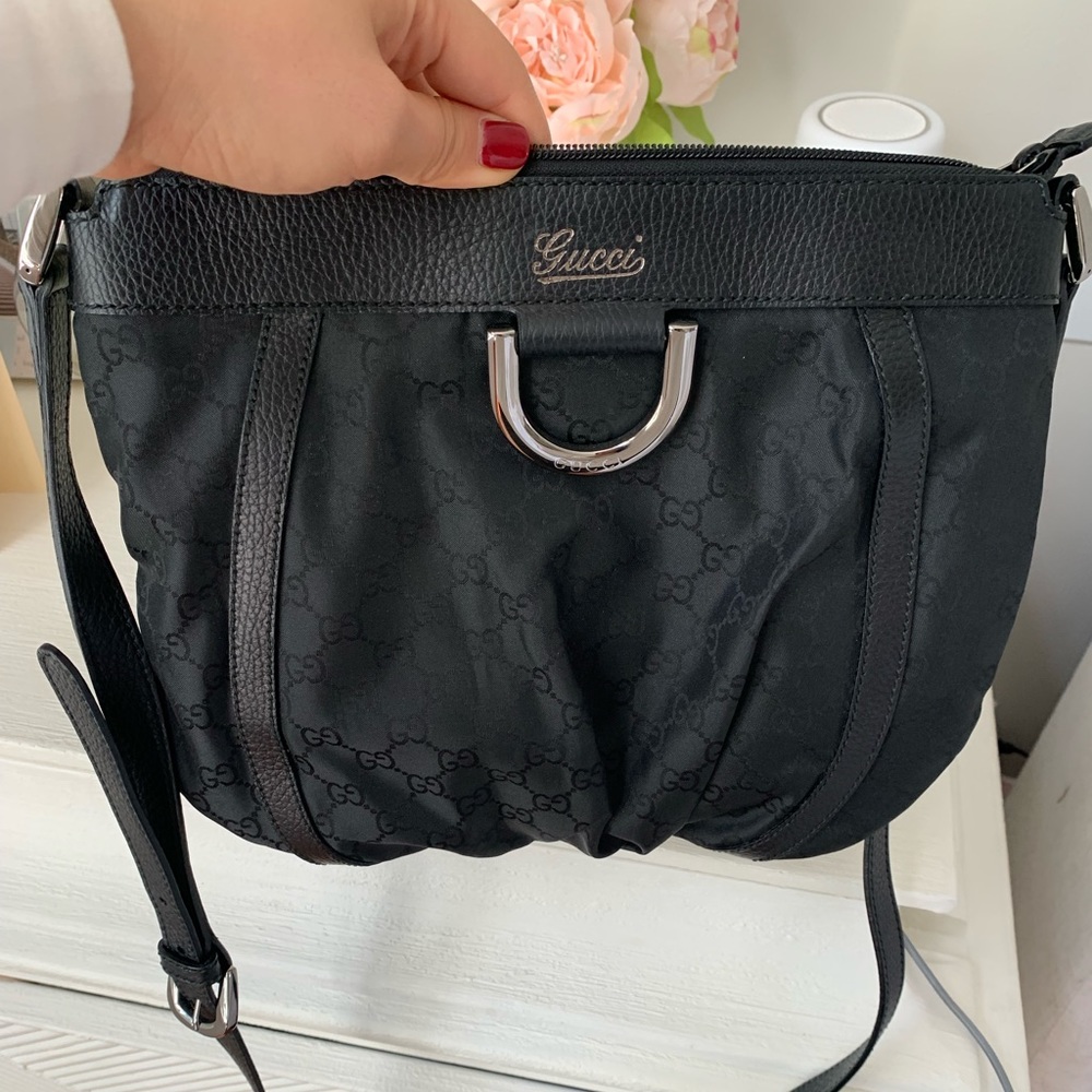 Black Gucci crossbody bag.